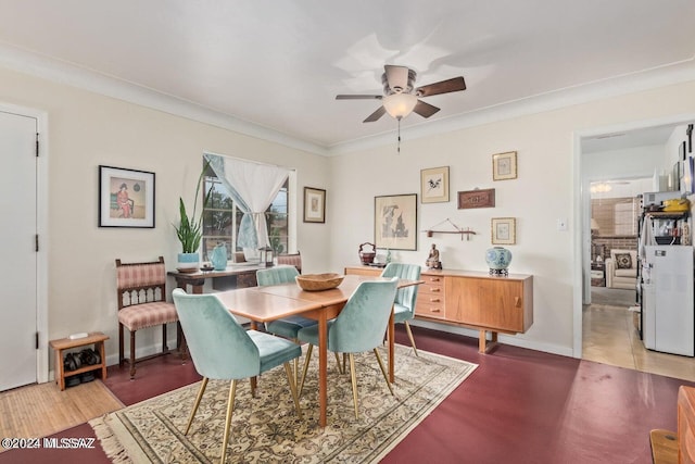 dining space with tile patterned flooring, ceiling fan, and ornamental molding