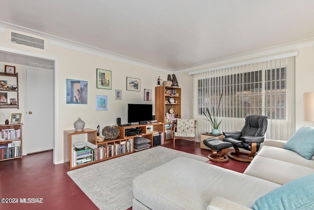 living room with hardwood / wood-style floors and ornamental molding