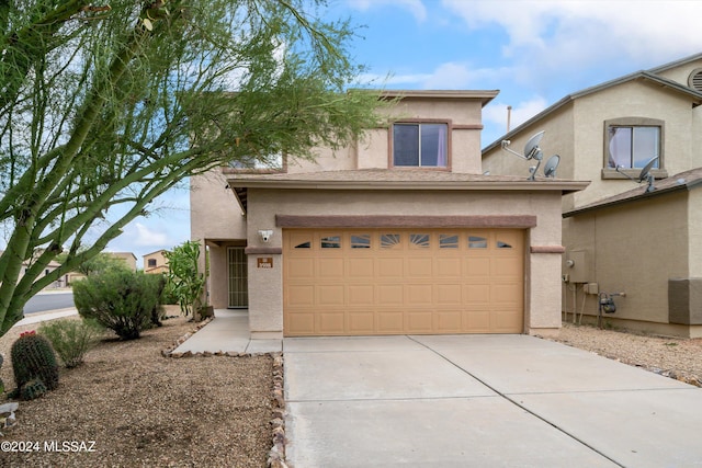 view of front of home with a garage