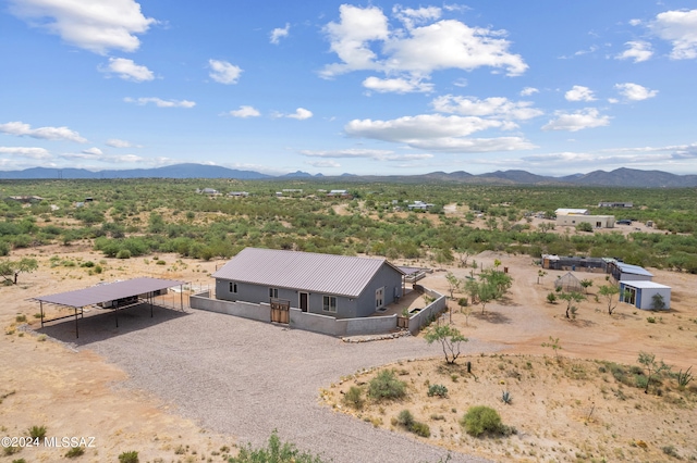 birds eye view of property with a mountain view