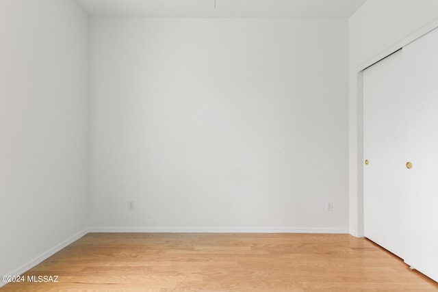 unfurnished room with light hardwood / wood-style flooring