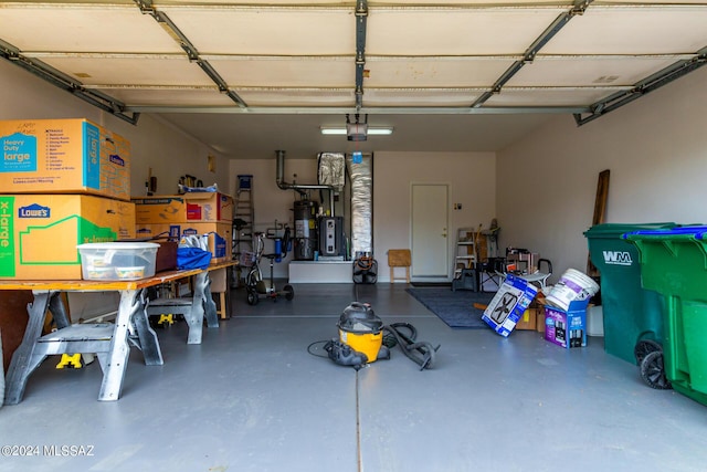 garage with a garage door opener and gas water heater