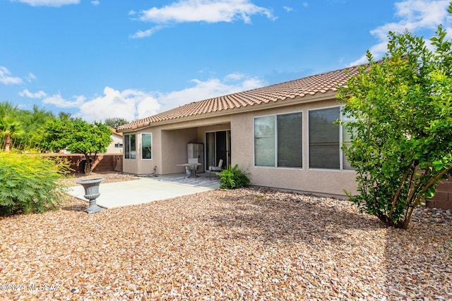 rear view of house featuring a patio