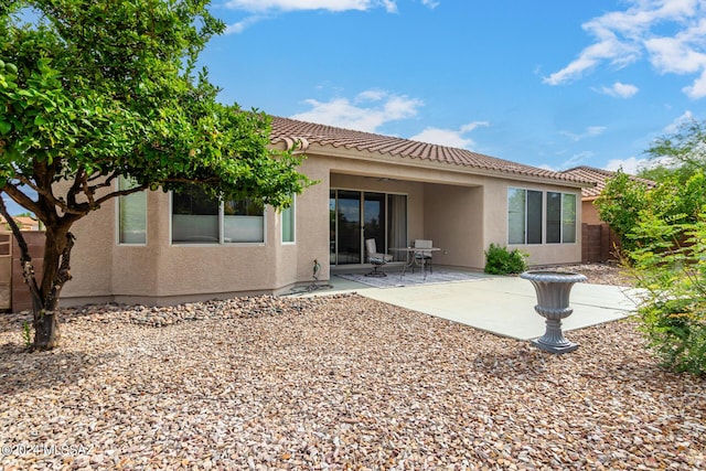 back of property featuring a patio area