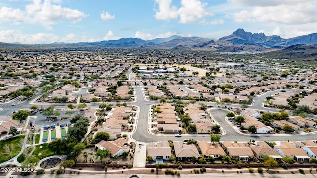 birds eye view of property featuring a mountain view