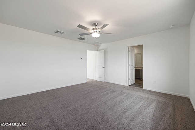 carpeted empty room featuring ceiling fan