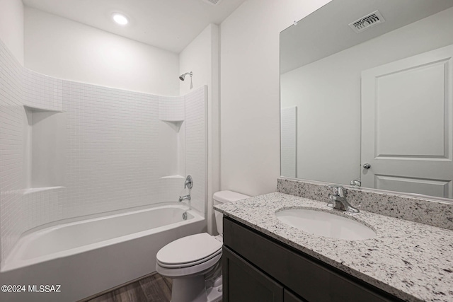 full bathroom with washtub / shower combination, toilet, vanity, and wood-type flooring