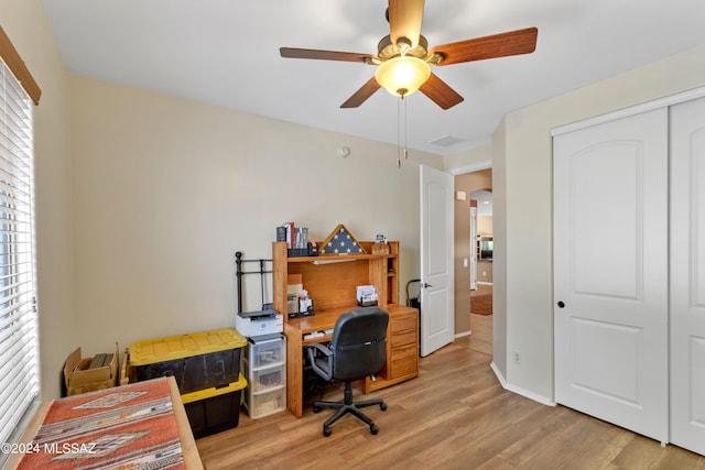 office featuring light wood-style floors and ceiling fan
