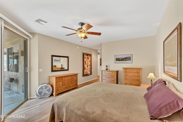 bedroom featuring a ceiling fan, wood finished floors, baseboards, access to outside, and visible vents