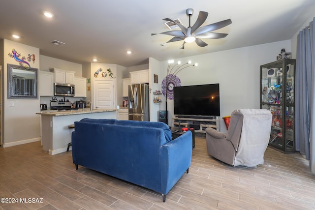 living room with ceiling fan