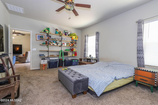 carpeted bedroom featuring ceiling fan