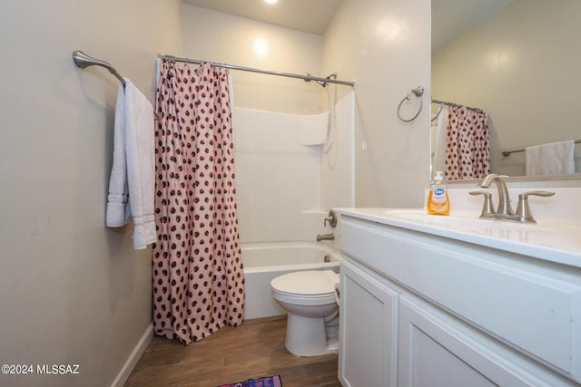 full bathroom with hardwood / wood-style flooring, vanity, toilet, and shower / bath combo with shower curtain