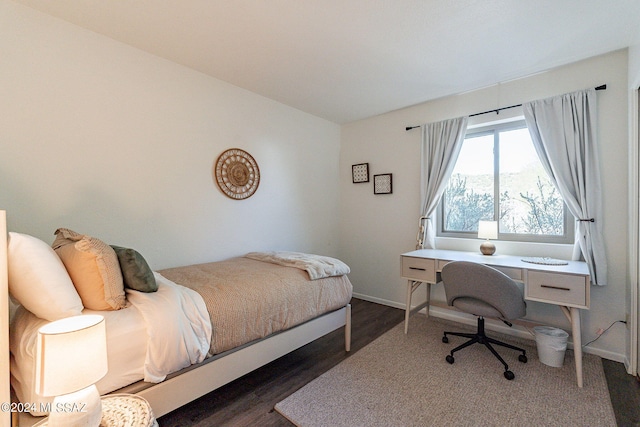 bedroom featuring dark hardwood / wood-style floors