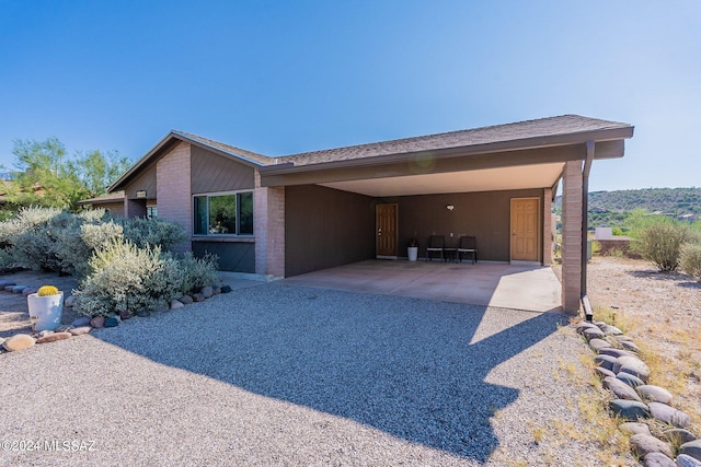 view of front of house featuring a carport