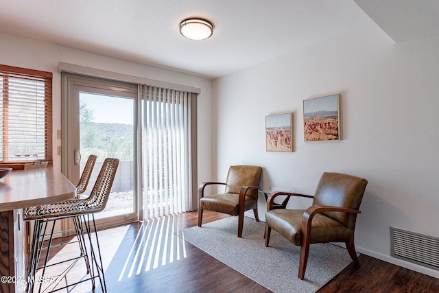 living area with hardwood / wood-style floors