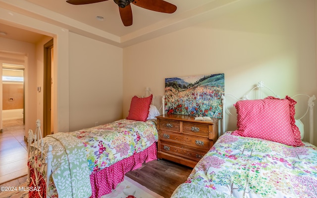 bedroom with wood finished floors and a ceiling fan