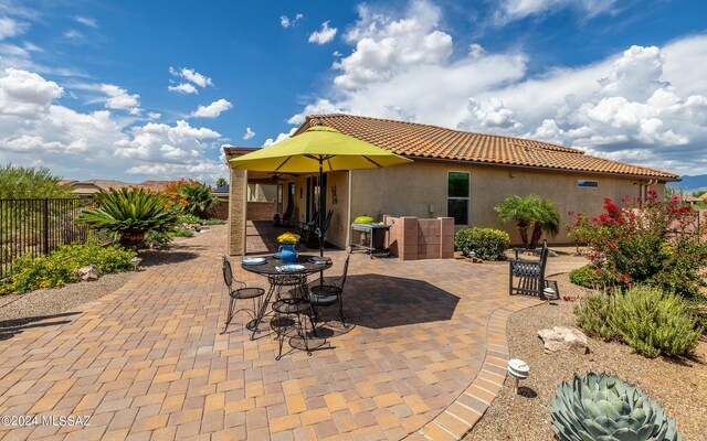 view of patio featuring fence