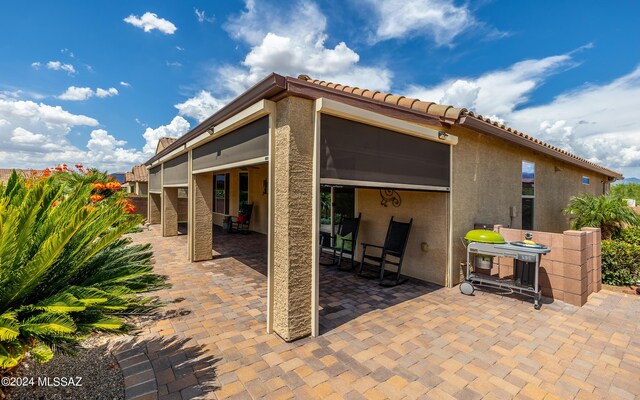 back of house with a patio