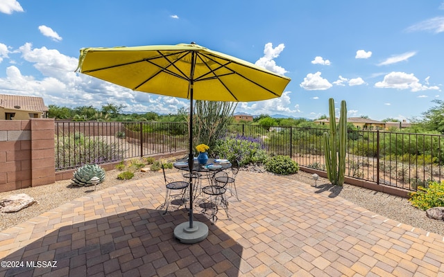 view of patio featuring fence