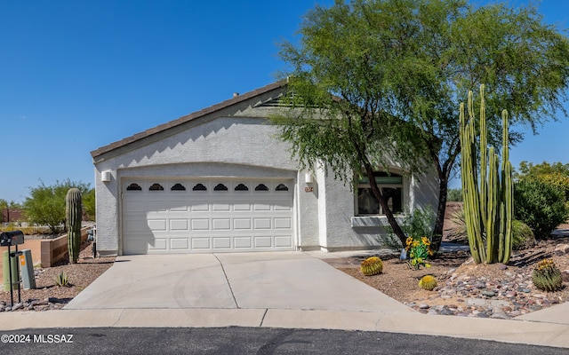 ranch-style house featuring a garage