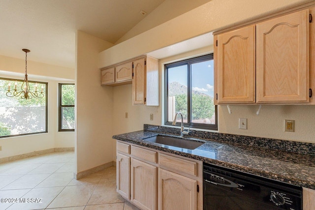 kitchen featuring light tile patterned floors, sink, a healthy amount of sunlight, and black dishwasher