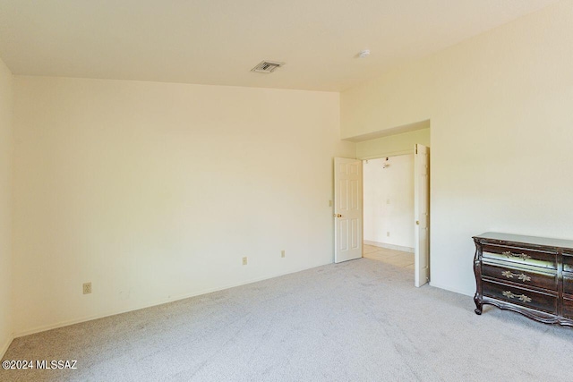 unfurnished bedroom with light colored carpet