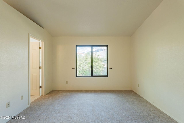 empty room featuring light carpet