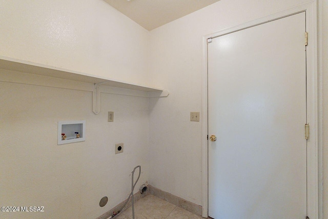 laundry area with light tile patterned flooring, hookup for an electric dryer, and washer hookup