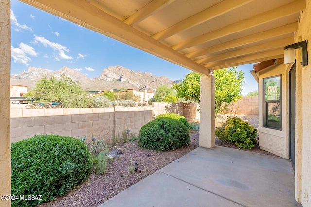 view of patio / terrace featuring a mountain view