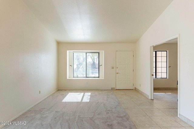 spare room featuring light tile patterned floors