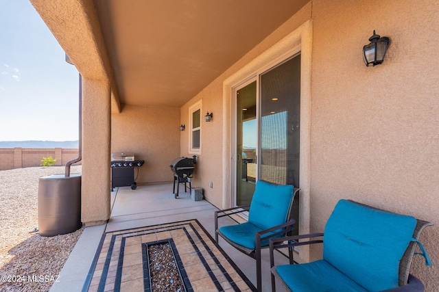 view of patio / terrace with area for grilling and a mountain view