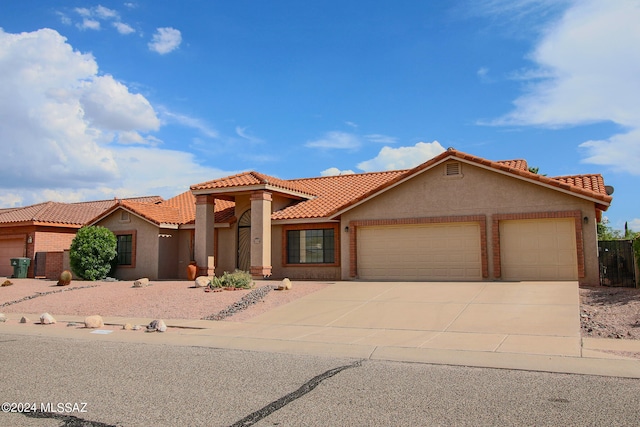 mediterranean / spanish-style home featuring a garage