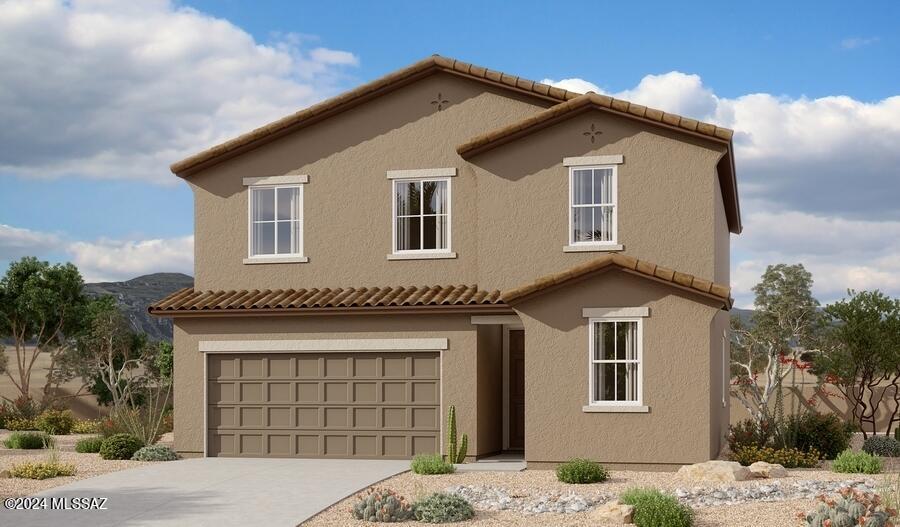 view of front of property with an attached garage, a tile roof, concrete driveway, and stucco siding