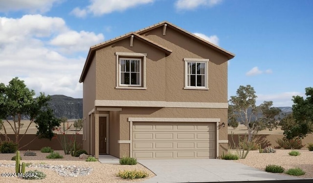 front of property with a garage and a mountain view