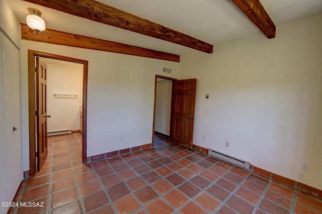 spare room featuring tile patterned flooring, a baseboard radiator, and beamed ceiling