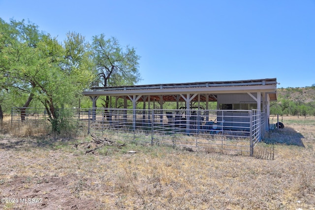 view of outdoor structure with a rural view