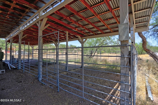 view of horse barn with an outbuilding