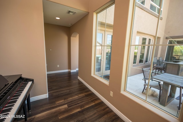 hallway with dark wood-type flooring