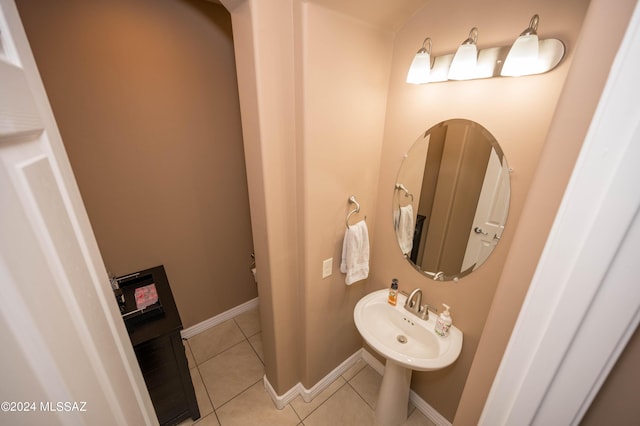 bathroom with sink and tile patterned flooring