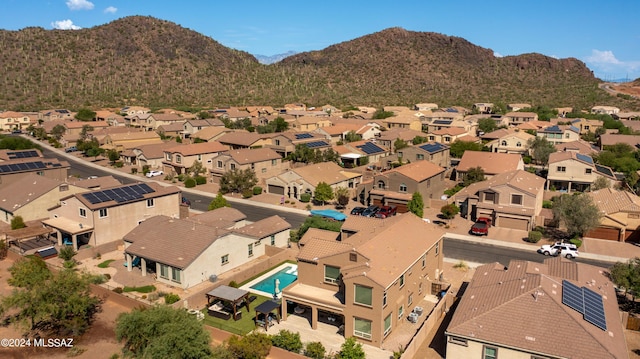 birds eye view of property with a mountain view