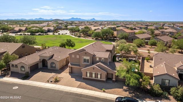 birds eye view of property with a mountain view and a residential view