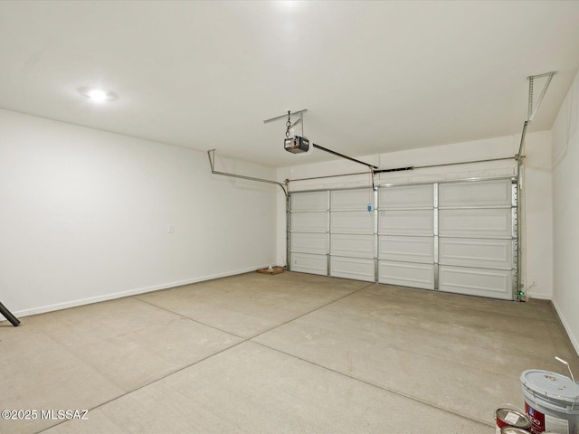 garage featuring baseboards and a garage door opener
