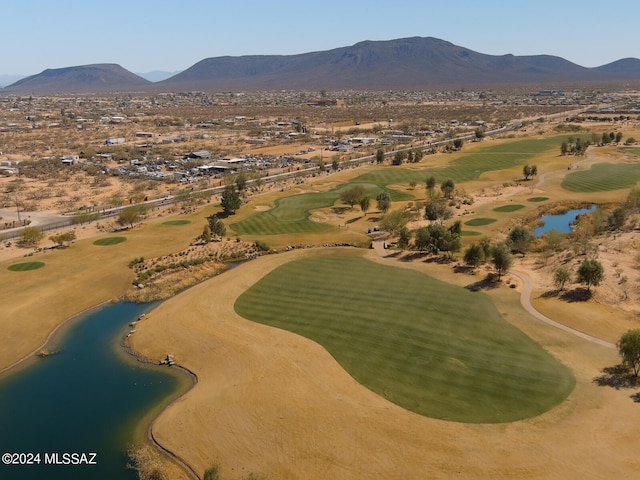 drone / aerial view featuring a water and mountain view and view of golf course
