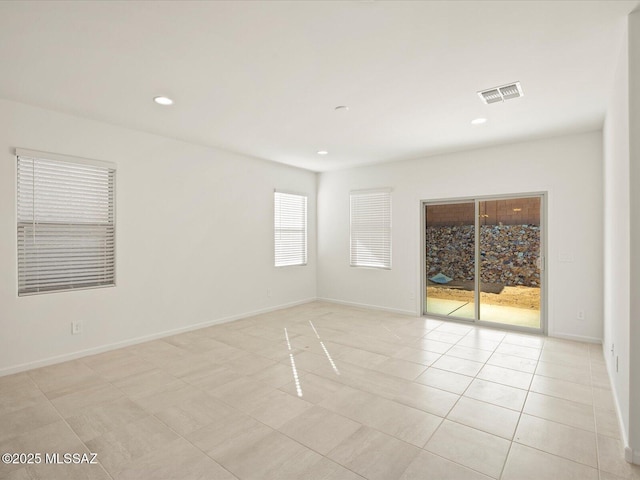 unfurnished room featuring visible vents, recessed lighting, baseboards, and light tile patterned floors