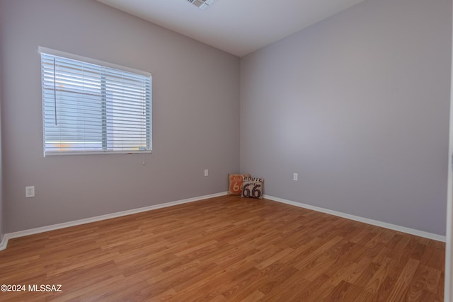 spare room featuring light wood-type flooring