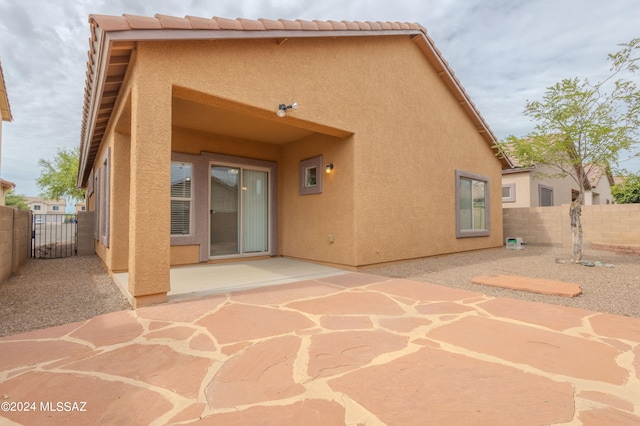 rear view of house with a patio