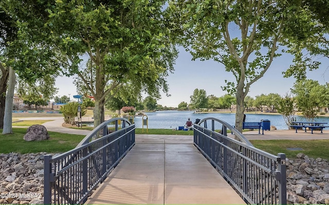 surrounding community featuring a water view