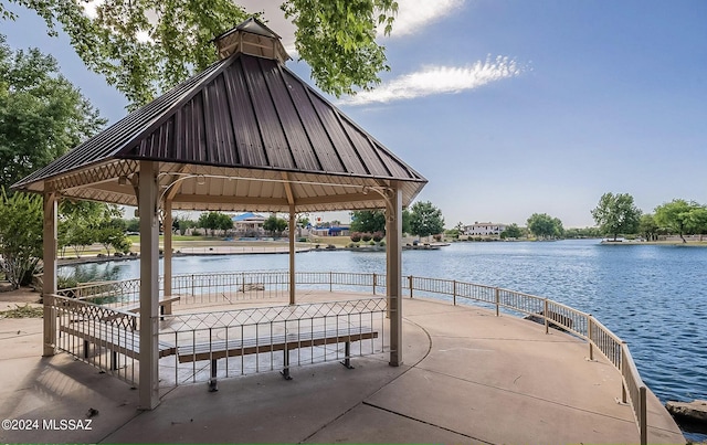 view of community with a water view and a gazebo