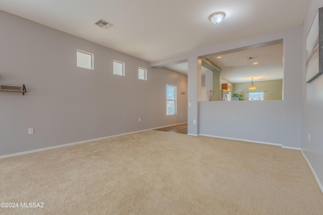 empty room featuring carpet flooring