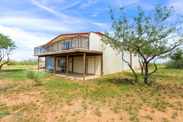 rear view of property with a patio area